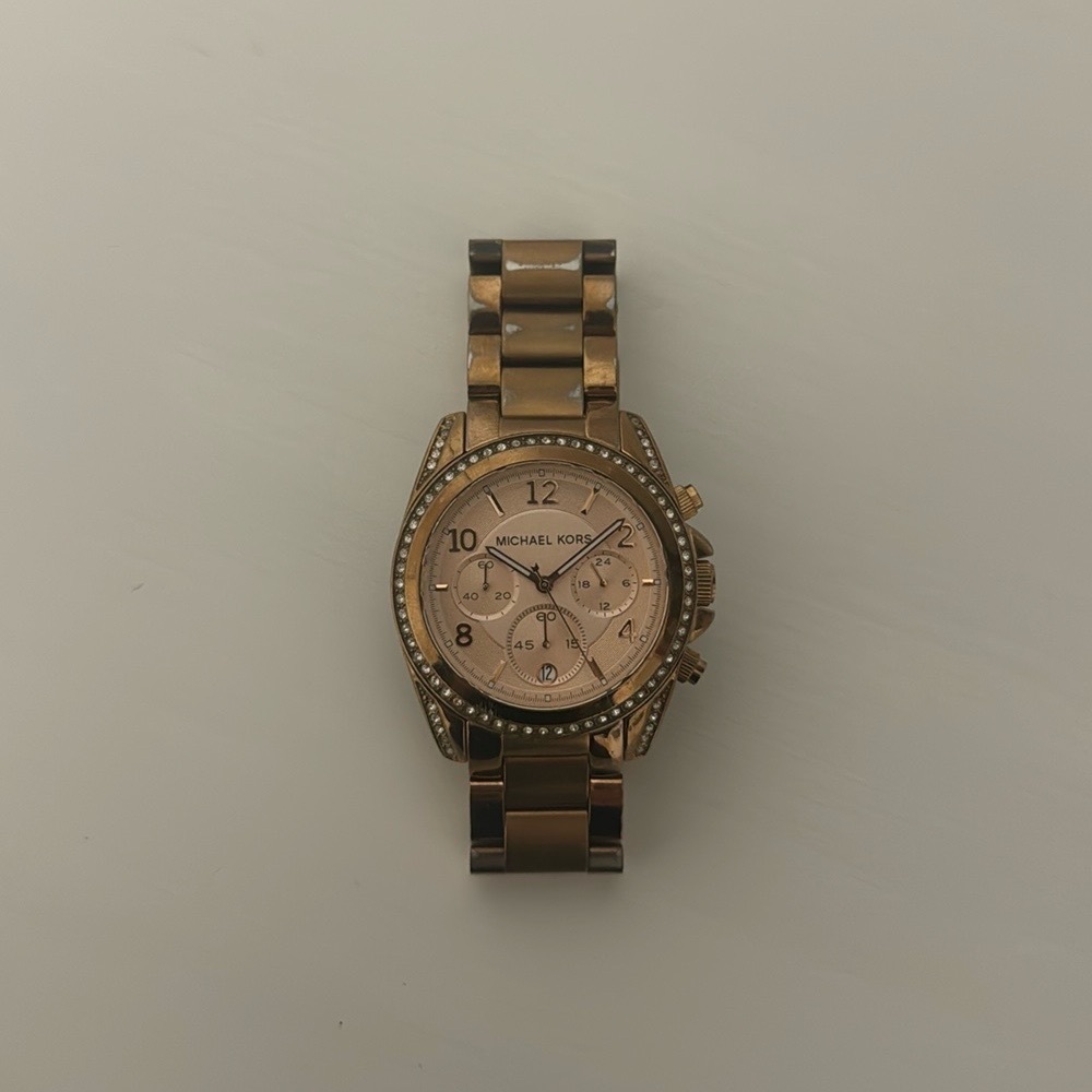 Michael Kors woman’s rose gold wrist watch
